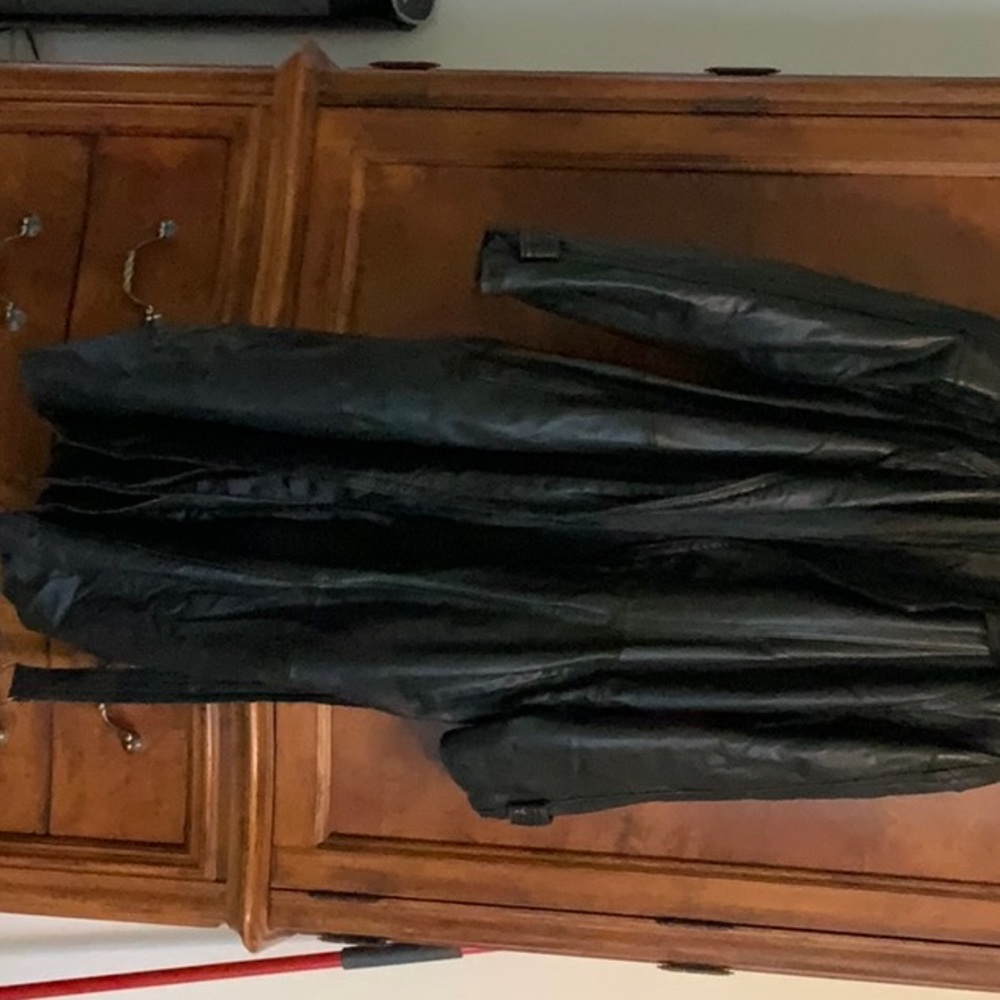 Like new black Genuine leather trench coat with belt.
